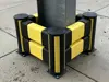 black and yellow impact protection protecting a pillar 