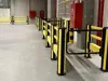 pedestrian barrier with high impact barrier and a swing gate
