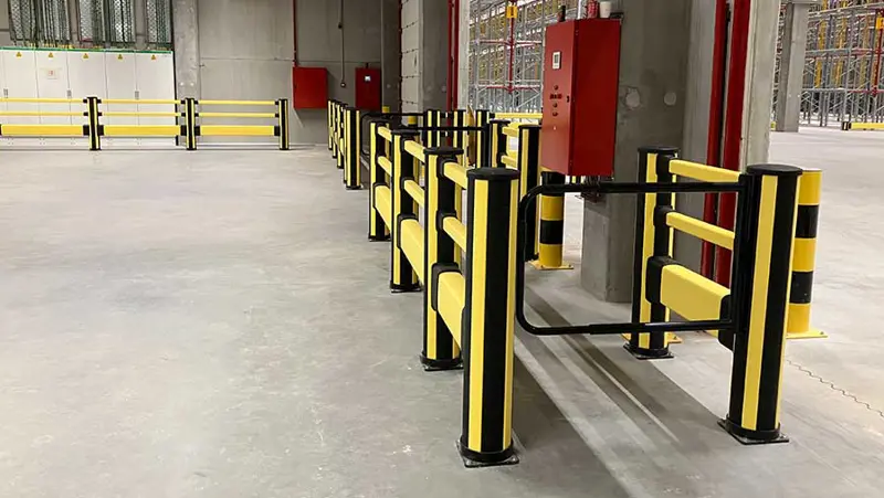 pedestrian barrier with high impact barrier and a swing gate